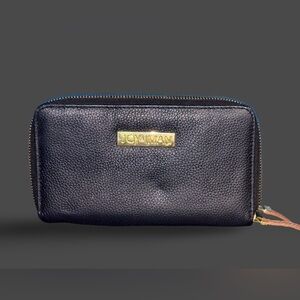Joy & Iman brand black, zip-around leather wallet with gold-tone hardware